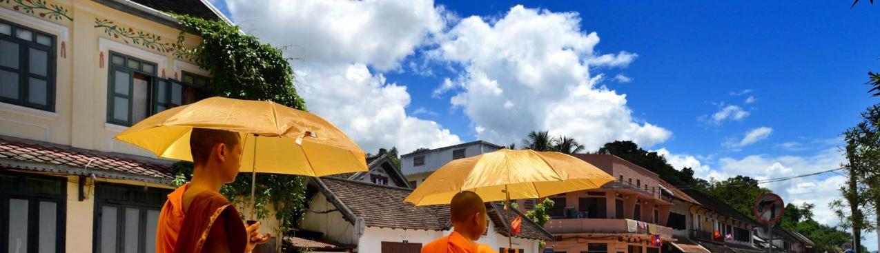 Monks with umbrellas