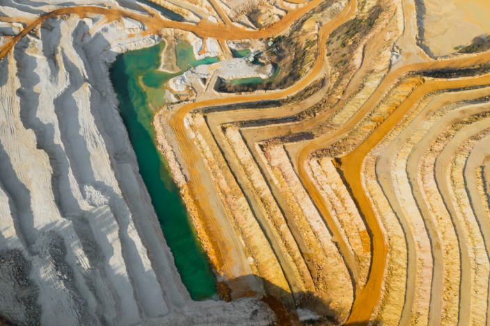 65d87abb278c1e4ffb7598ab_top-view-on-a-stone-quarry-arial-view-on-a-mining-2023-11-27-05-16-02-utc.png