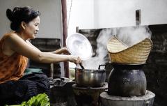 Woman cooking in Asia