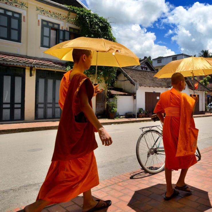 Monks with umbrellas