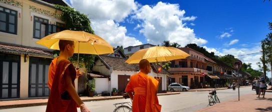 Monks with umbrellas